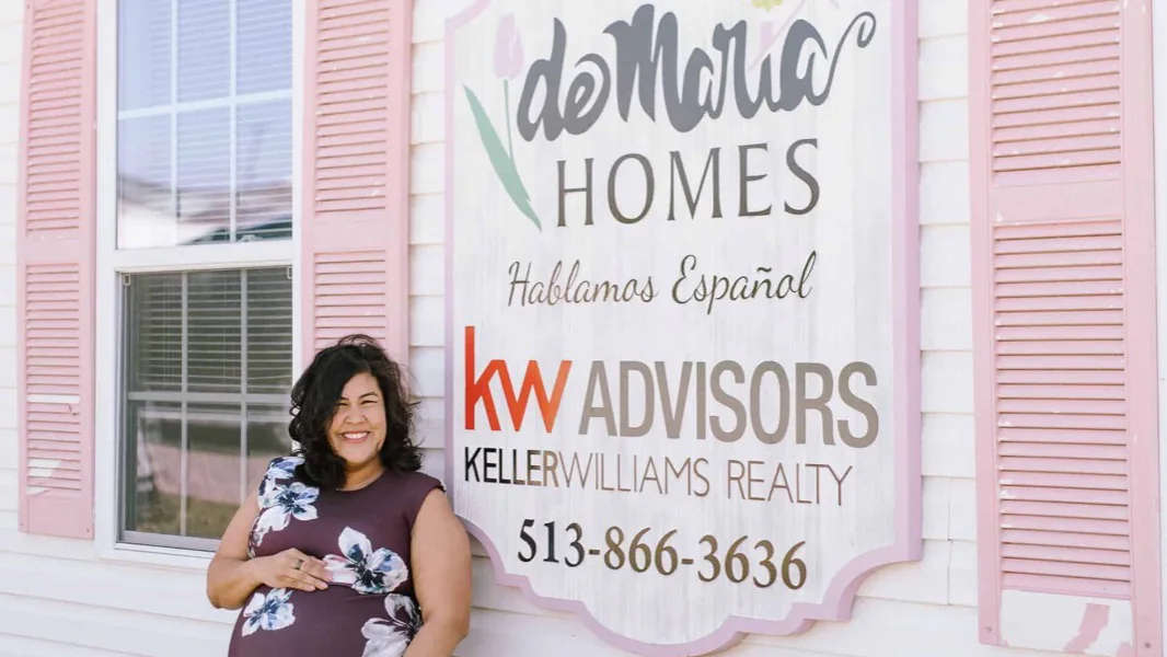 Flor De Maria McNally outside the deMaria Homes office