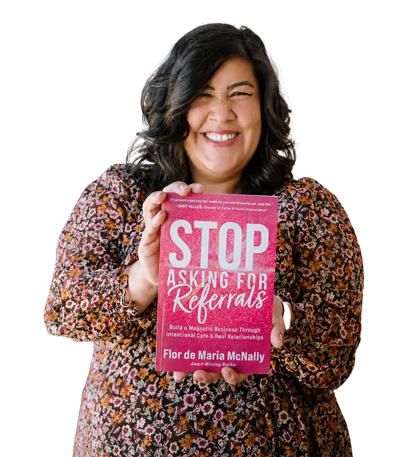 Flor De Maria McNally holding her book, Stop Asking for Referrals