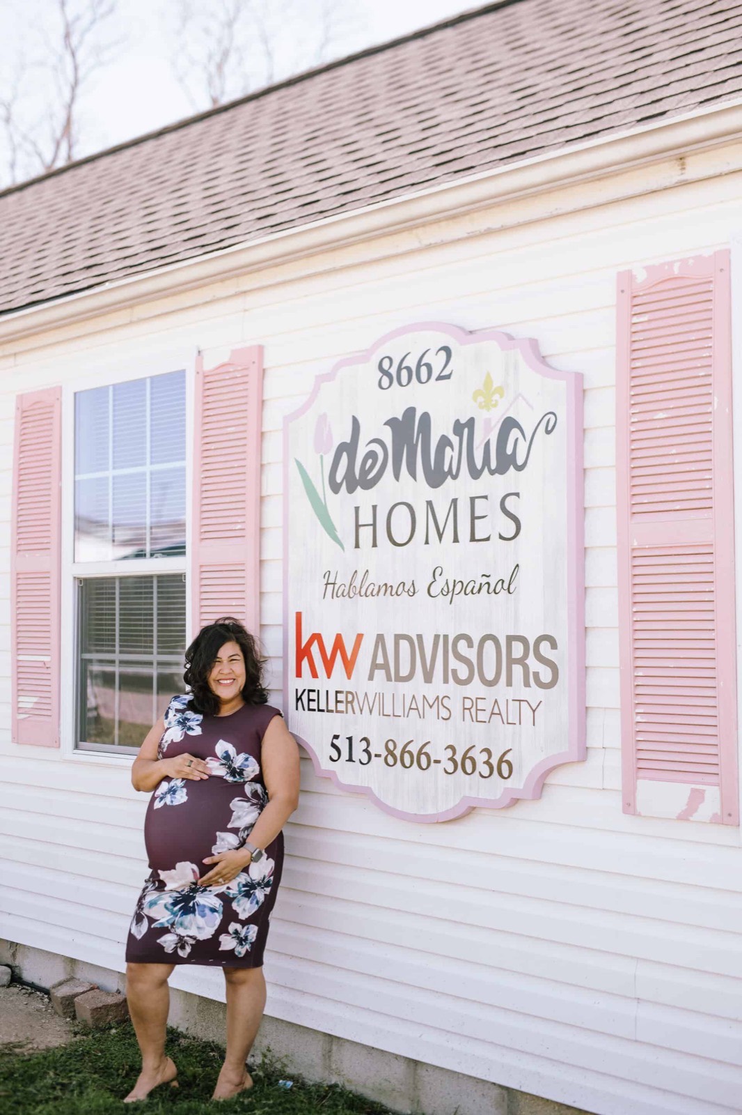 Flor standing outside the deMaria Homes office