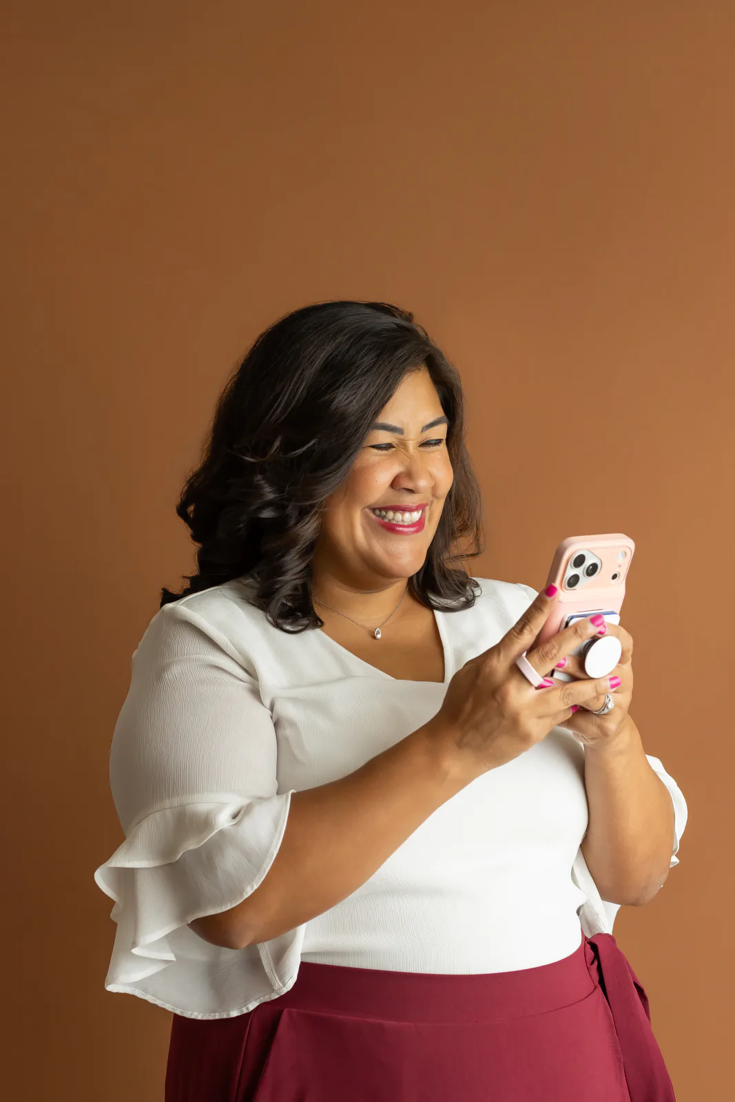 Flor De Maria McNally smiling while on a call